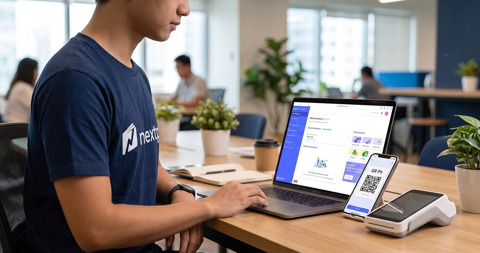 A team at work in a Philippine startup co-working space, with the NextPay dashboard open on a laptop, a QR Ph payment on a phone, and a card payment terminal on the desk.